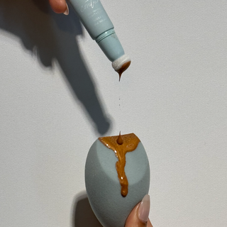 Dolce Glow-Liquid contour being applied to a makeup sponge