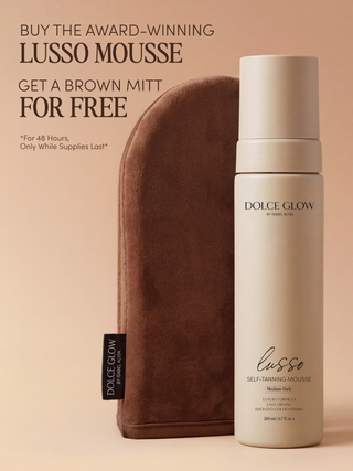 Dolce Glow Lusso Mousse self-tanning mousse bottle next to a brown application mitt 