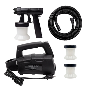 Dolce Glow Compact Tanning System sprayer kit with a handheld spray gun, coiled hose, power cord, and two extra white cups on a plain white background.