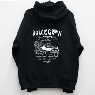 
  
    Dolce Glow Black Hoodie featuring the 'In the Desert Tour' design in white
  
