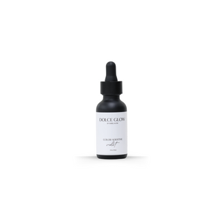 
  
    Dolce Glow Color Correcting Violet Drops in a black bottle with a dropper.
  
