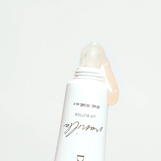 Dolce Glow Lip Butter shown open, highlighting its lightweight and glossy texture.